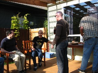 A vanpool tradition. Whenever a poolie has an out-of-town visitor, we all gather to stare, nibble, and knock back a few cocktails.